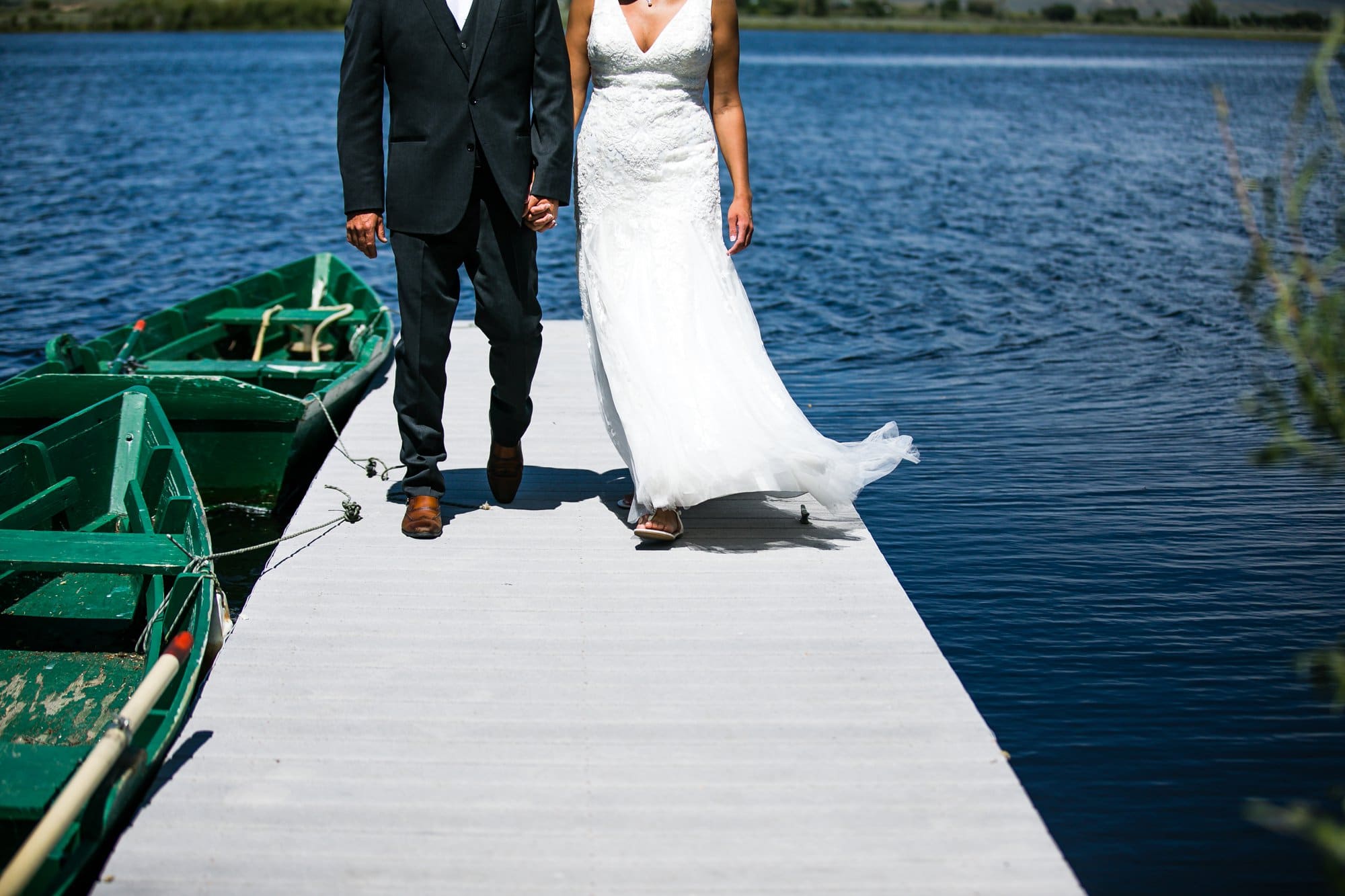 bride groom walking on boat dock