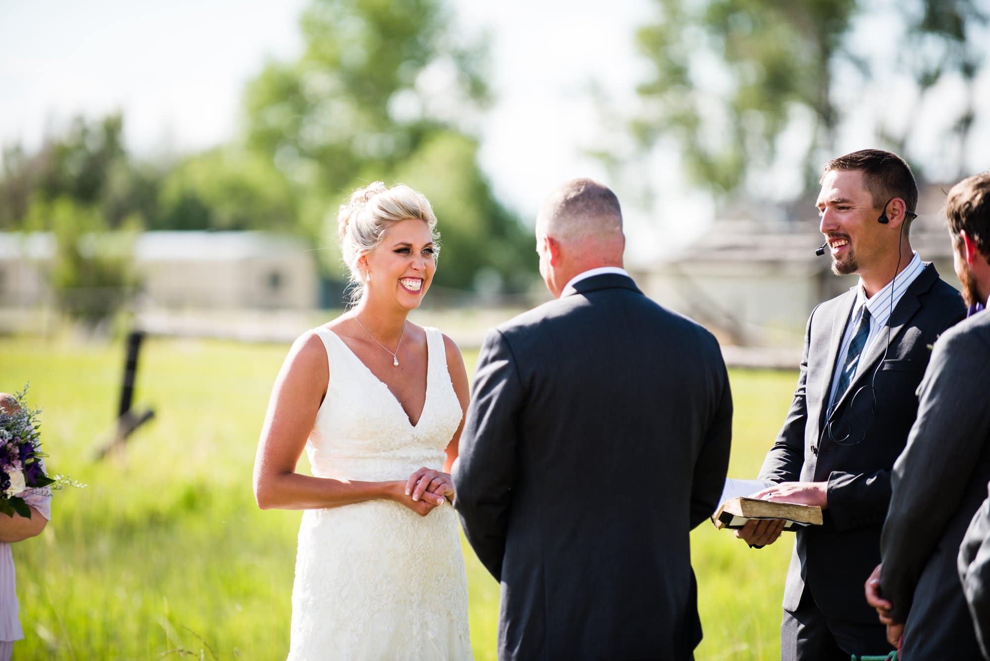 Bride and groom smiling during ceremony