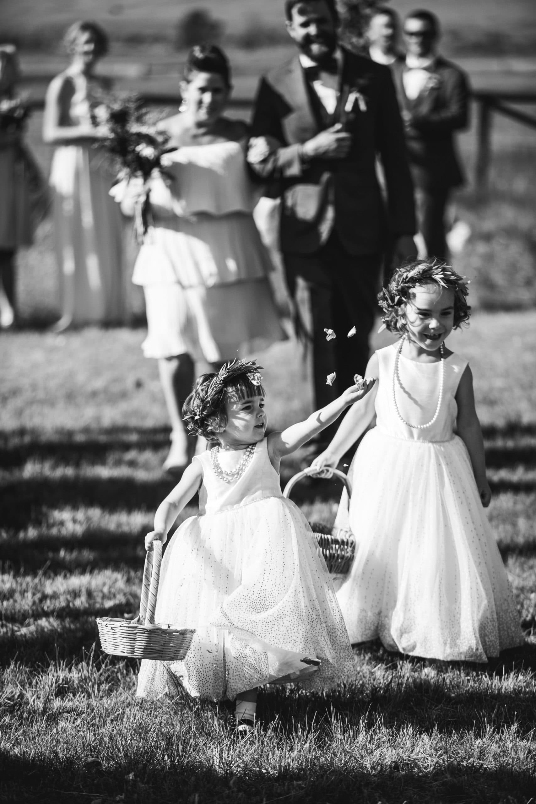 flower girls tossing flowers