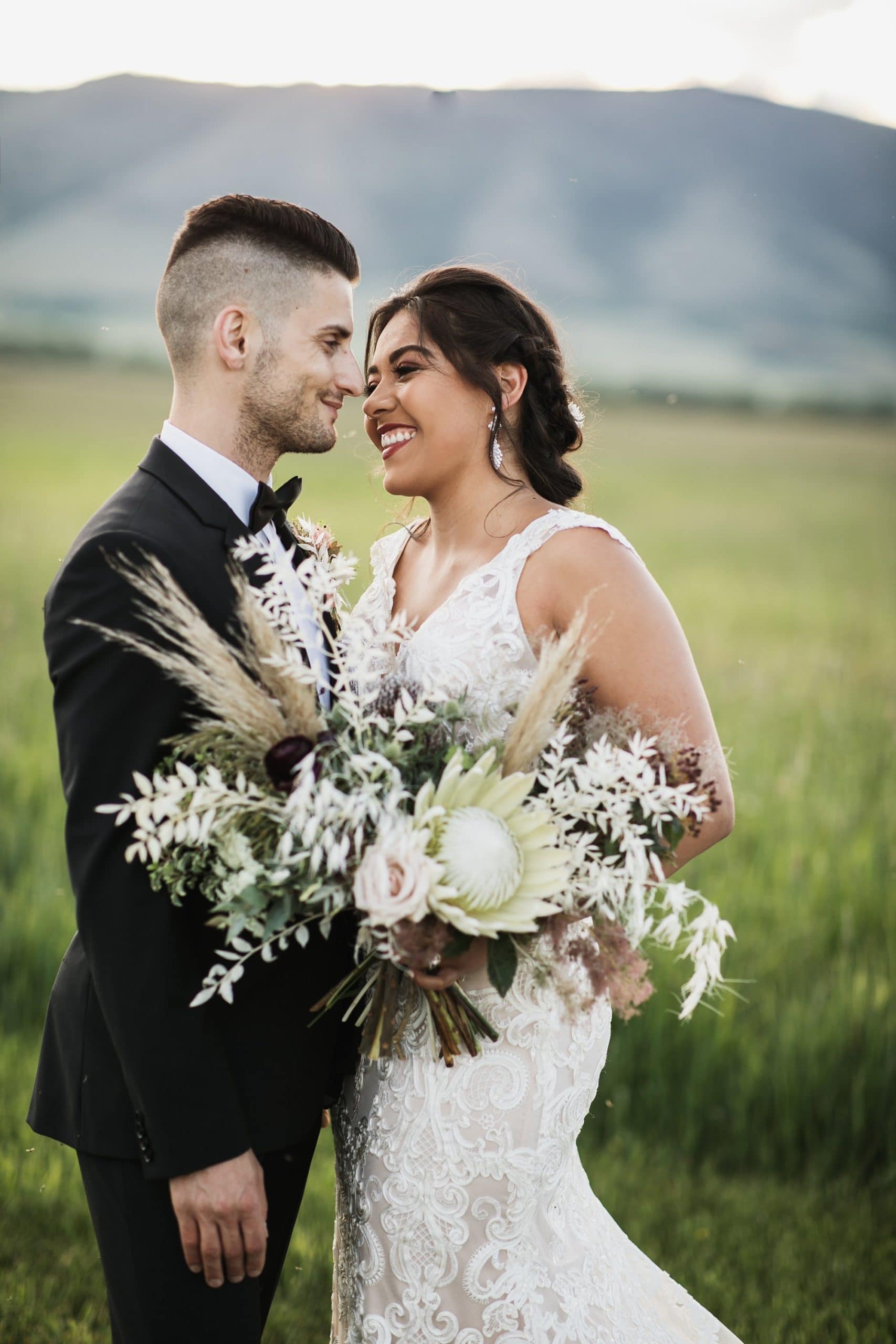 bride and groom in meadow