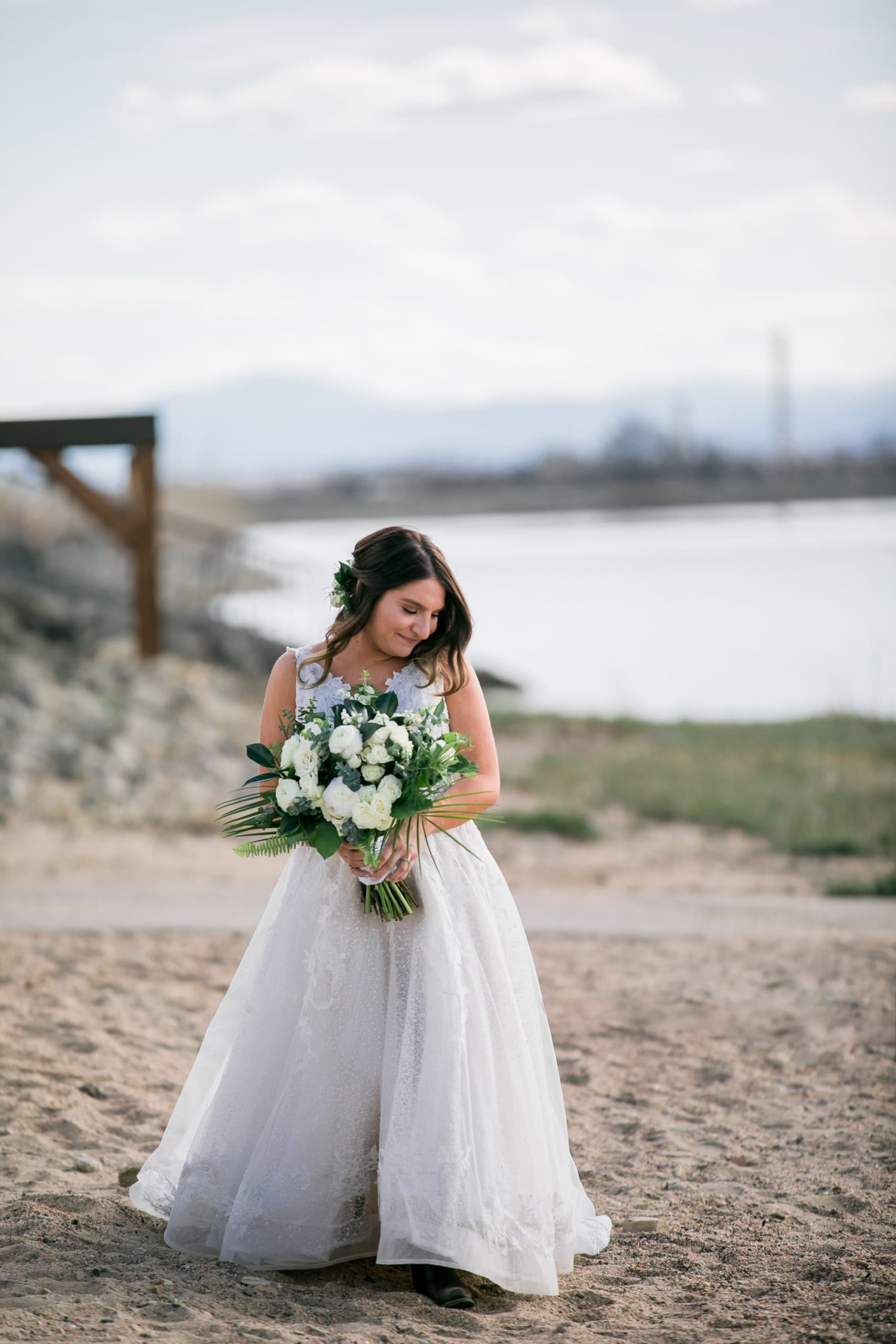 bride walking down beach aisle