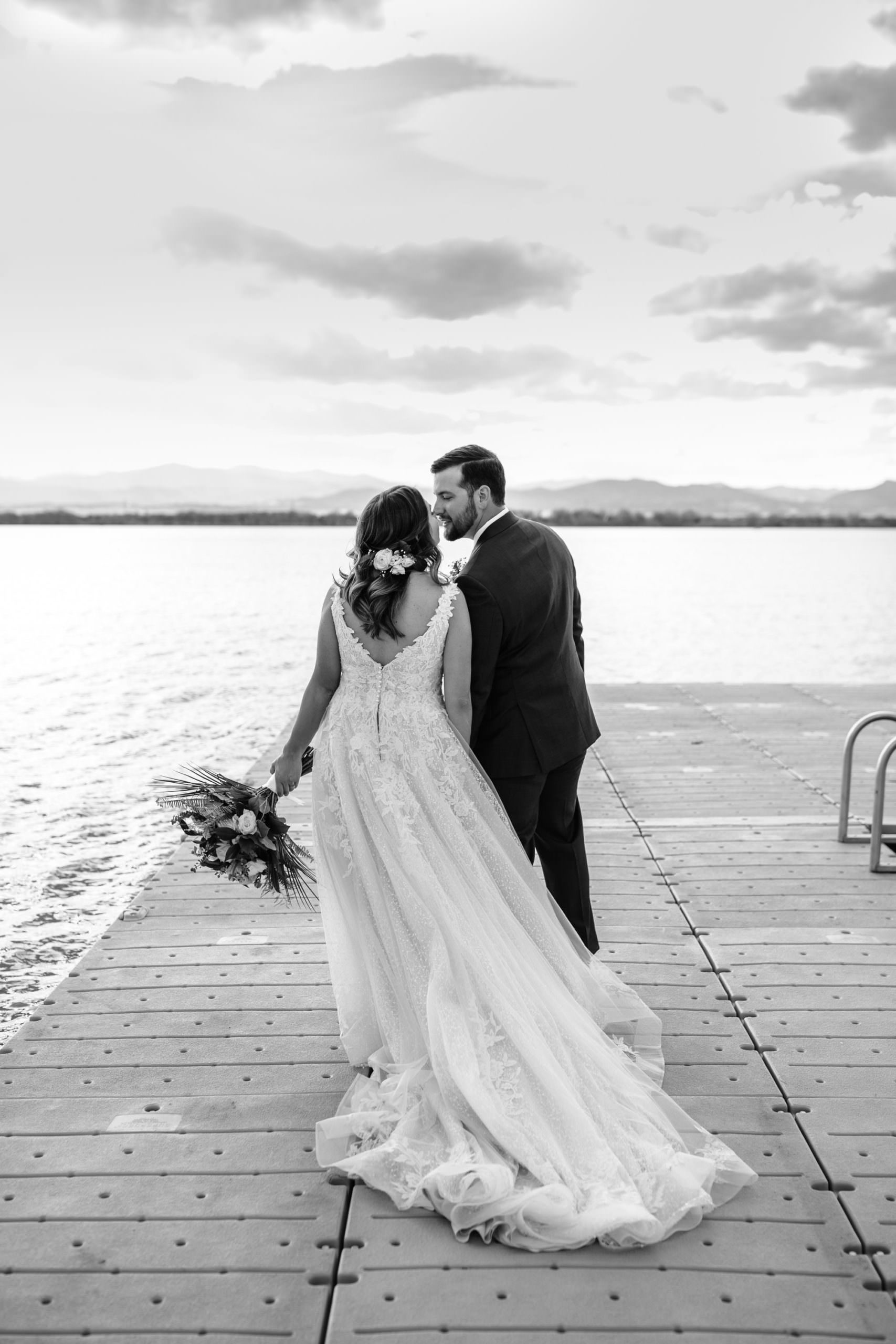 bride and groom on boat dock