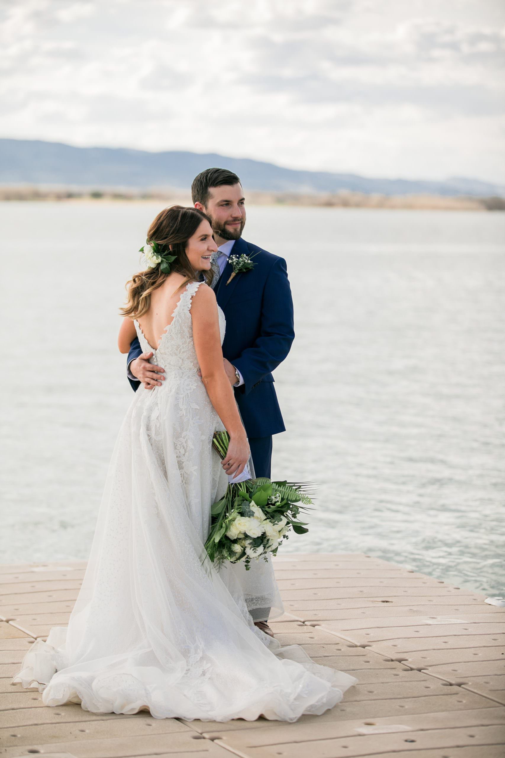 bride and groom on colorado lake