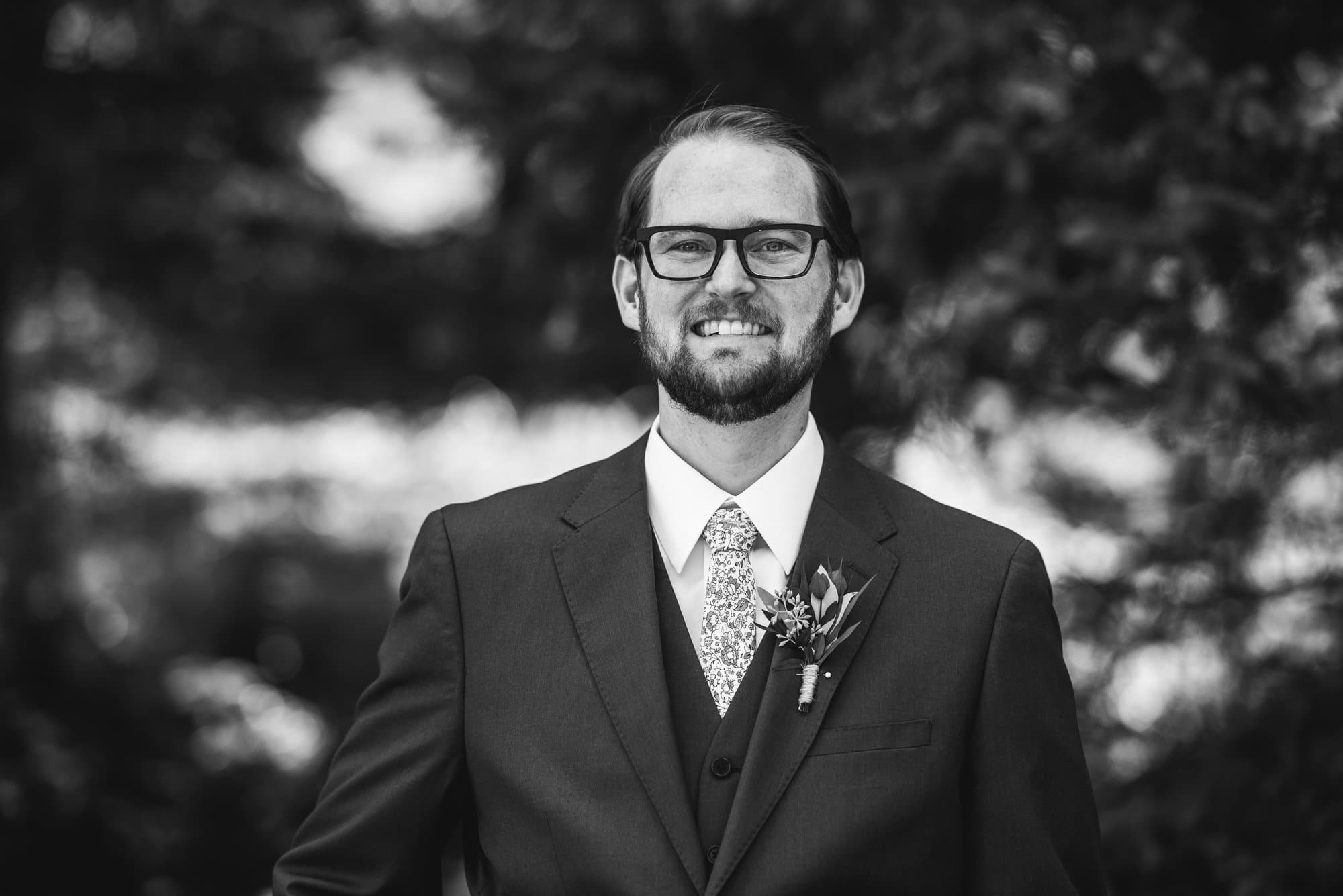 groom in mountain setting