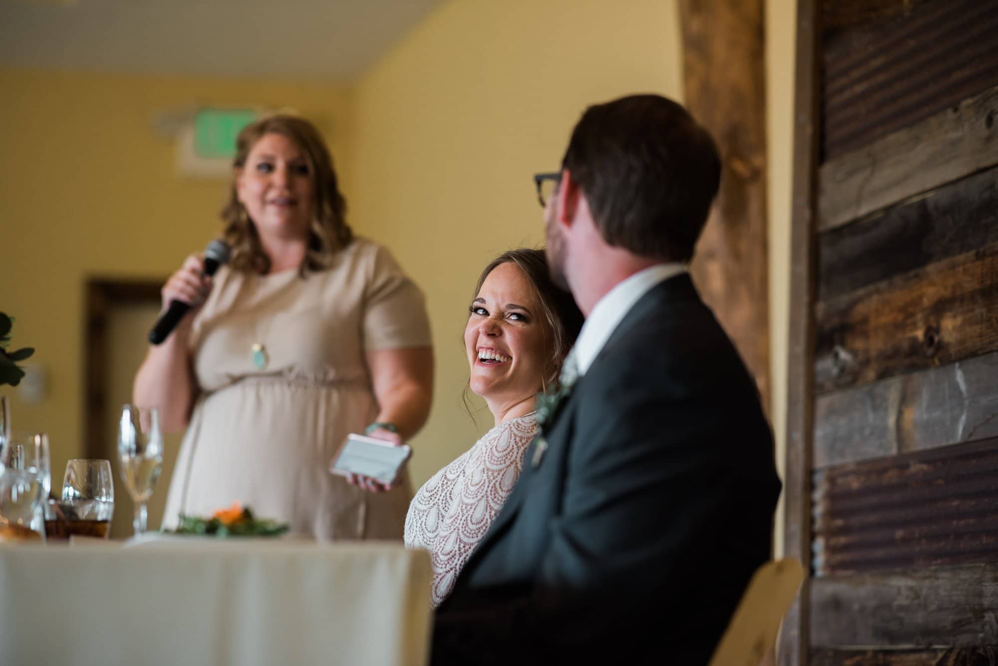 Reception toast, bride reacting