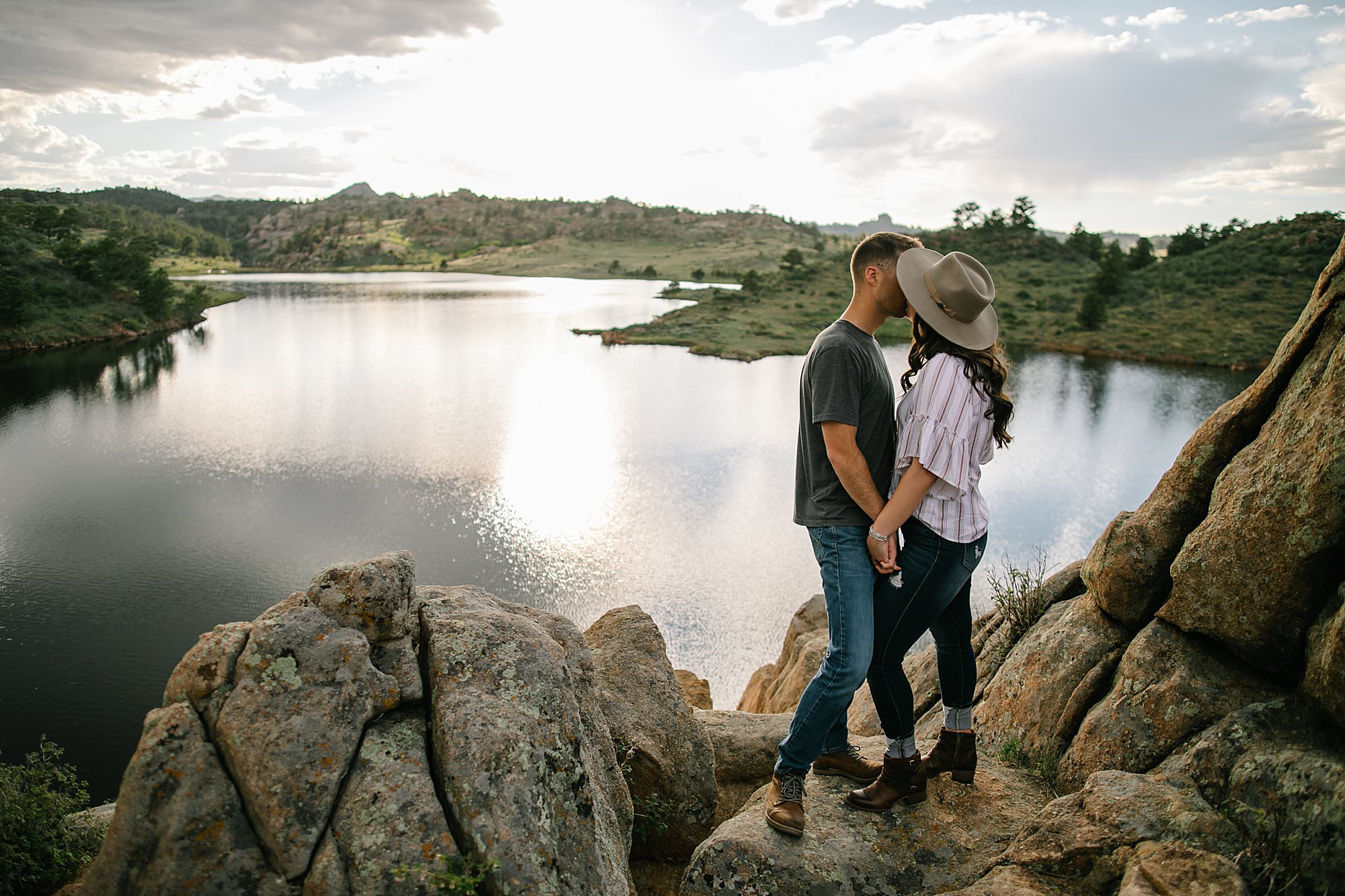 sunset engagement photo over water in Wyoming