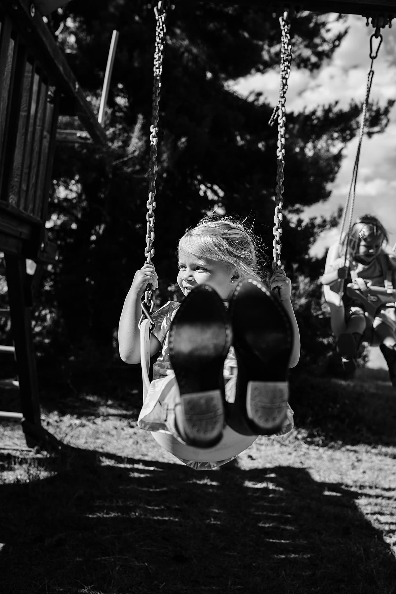 girl swinging with boots