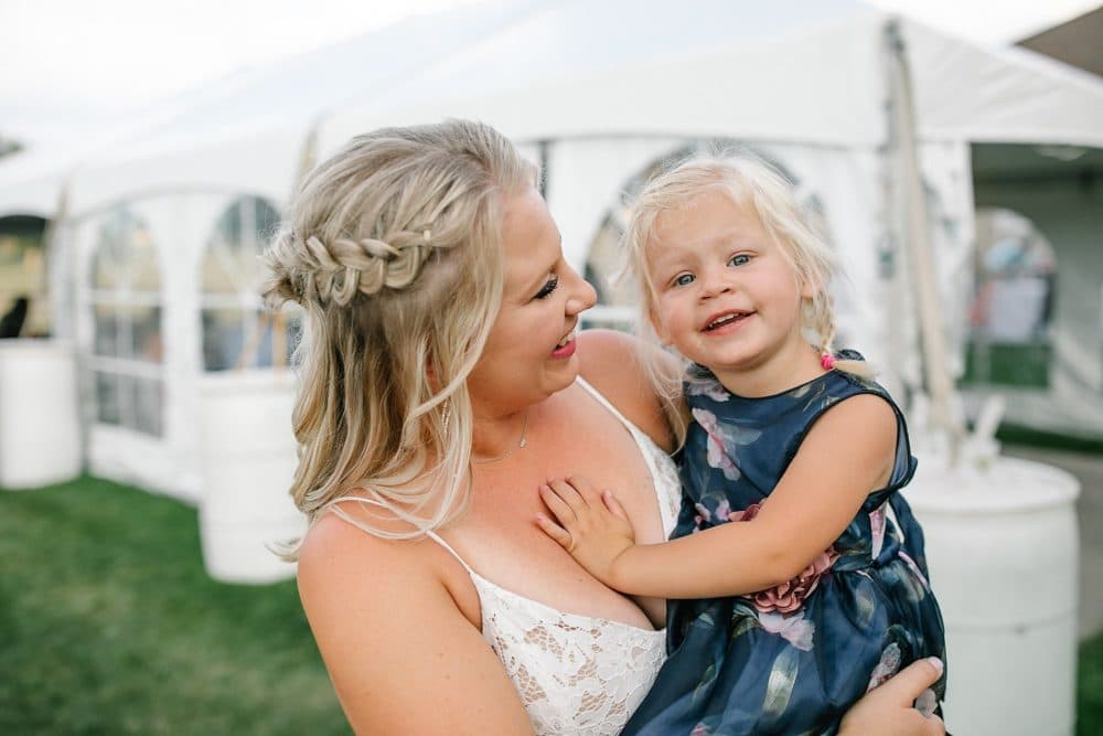 bride with daughter laughing