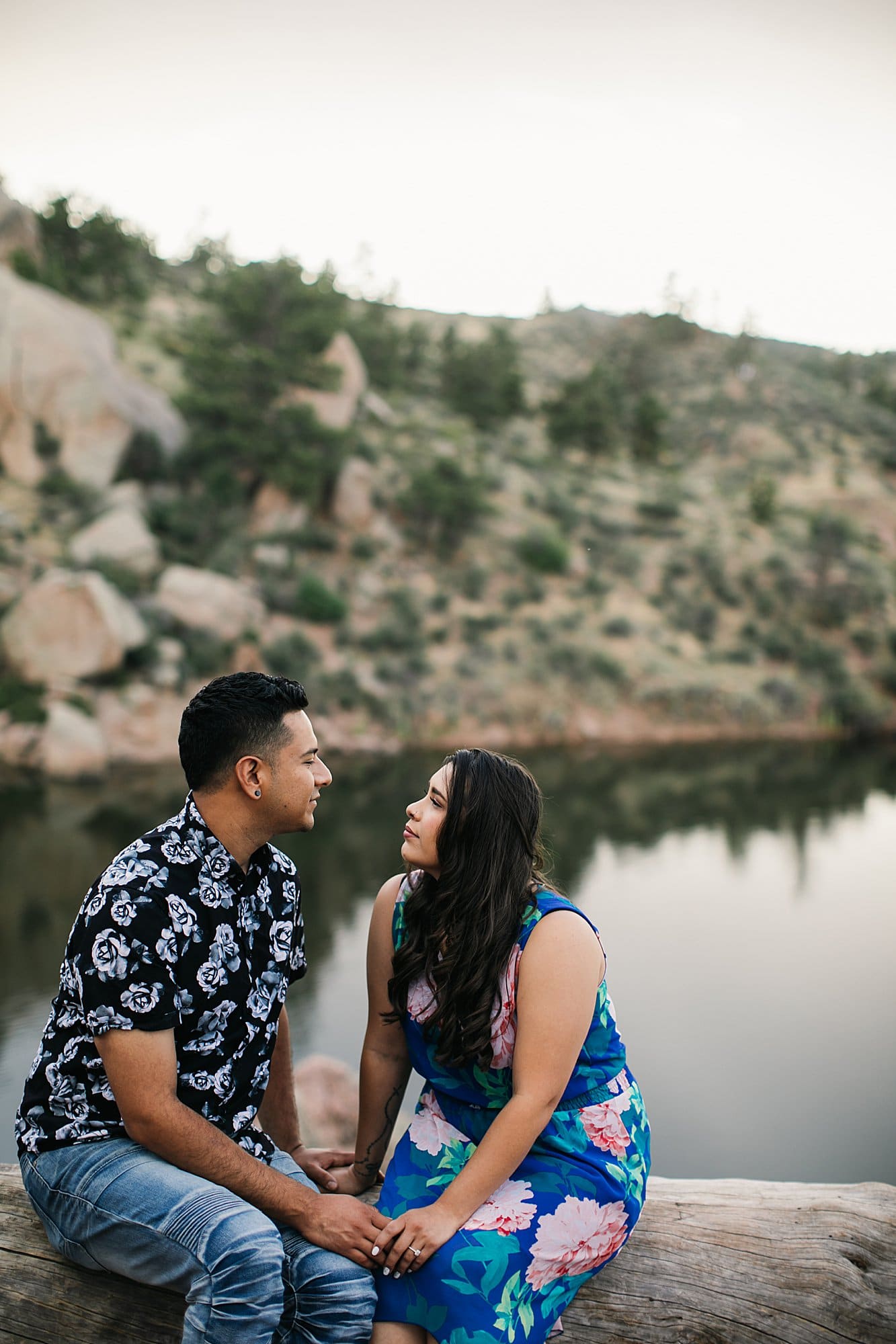 couples portrait by water in mountains